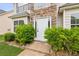 A close-up of the front door with stone accents and green bushes accenting the walkway at 2896 Chilhowee Dr, Atlanta, GA 30331