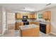 Bright kitchen featuring wood cabinets, stainless steel appliances, and a functional island at 2896 Chilhowee Dr, Atlanta, GA 30331