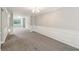 Spacious carpeted living room with natural light and elegant wainscoting at 2896 Chilhowee Dr, Atlanta, GA 30331