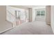 Sunlit living room with gray carpet, neutral walls, and white trim offers an inviting atmosphere at 2896 Chilhowee Dr, Atlanta, GA 30331