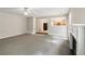 Open living room showcasing a fireplace, neutral carpet, and a view into the kitchen and breakfast bar at 2896 Chilhowee Dr, Atlanta, GA 30331