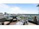 Spacious balcony features city skyline view with comfortable seating and glass railings at 45 Ivan Allen Jr Nw Blvd # 2705, Atlanta, GA 30308