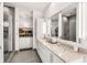Bathroom features double sinks, large mirrors, glass-enclosed shower, and walk-in closet at 45 Ivan Allen Jr Nw Blvd # 2705, Atlanta, GA 30308