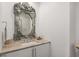 Elegant bathroom with a decorative mirror and marble countertop at 45 Ivan Allen Jr Nw Blvd # 2705, Atlanta, GA 30308