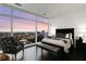 Inviting bedroom featuring skyline views and dark wood floors at 45 Ivan Allen Jr Nw Blvd # 2705, Atlanta, GA 30308