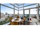 Bright dining area with city views features a modern round table and balcony access at 45 Ivan Allen Jr Nw Blvd # 2705, Atlanta, GA 30308
