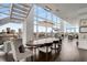 Bright dining room with city views features modern chandelier and ample seating for upscale urban living at 45 Ivan Allen Jr Nw Blvd # 2705, Atlanta, GA 30308