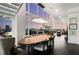 Open dining room featuring floor-to-ceiling windows with incredible city views and modern chandelier at 45 Ivan Allen Jr Nw Blvd # 2705, Atlanta, GA 30308
