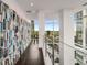 Bright hallway featuring a wall of bookshelves and a cityscape view at 45 Ivan Allen Jr Nw Blvd # 2705, Atlanta, GA 30308