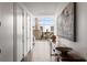 Contemporary hallway with hardwood floors leading to a living area with a piano and city views at 45 Ivan Allen Jr Nw Blvd # 2705, Atlanta, GA 30308