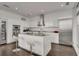 Modern kitchen with sleek white cabinetry, stainless steel appliances, and a center island with bar seating at 45 Ivan Allen Jr Nw Blvd # 2705, Atlanta, GA 30308
