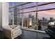 Modern living room showcasing floor-to-ceiling windows with stunning city views and comfortable seating at 45 Ivan Allen Jr Nw Blvd # 2705, Atlanta, GA 30308