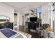 Bright main bedroom features dark wood floors, city views, and a large window at 45 Ivan Allen Jr Nw Blvd # 2705, Atlanta, GA 30308