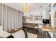 Bright office with floor-to-ceiling windows, built-in bookshelves, and sleek desk at 45 Ivan Allen Jr Nw Blvd # 2705, Atlanta, GA 30308