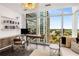 Bright office with floor-to-ceiling windows, built-in bookshelves, and sleek desk at 45 Ivan Allen Jr Nw Blvd # 2705, Atlanta, GA 30308