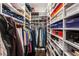 Organized walk-in closet with custom shelving and rods for ample storage space at 45 Ivan Allen Jr Nw Blvd # 2705, Atlanta, GA 30308