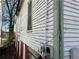 Side exterior view showing weathered siding, window and utility elements at 592 Formwalt Sw St, Atlanta, GA 30312