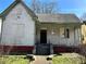 Exterior of home features a covered porch with mature landscaping at 592 Formwalt Sw St, Atlanta, GA 30312