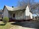 Side view of home featuring covered porch and mature trees at 592 Formwalt Sw St, Atlanta, GA 30312