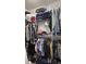 Well-organized closet with ample hanging space and shelving for clothing and accessories at 672 Mcgill Ne Pl # 672, Atlanta, GA 30312