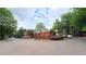Community brick building featuring well-manicured landscaping and ample parking at 672 Mcgill Ne Pl # 672, Atlanta, GA 30312