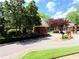 Charming gated community entrance with brick guardhouse and manicured landscaping at 672 Mcgill Ne Pl # 672, Atlanta, GA 30312