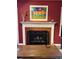 A cozy fireplace with colorful artwork and a wooden table at 672 Mcgill Ne Pl # 672, Atlanta, GA 30312