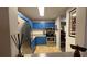 A cozy kitchen features stainless steel appliances and bold blue cabinetry for a unique design at 672 Mcgill Ne Pl # 672, Atlanta, GA 30312