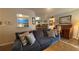 Cozy living room features a comfy couch, hardwood floors, and plenty of wall art at 672 Mcgill Ne Pl # 672, Atlanta, GA 30312