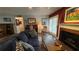 A bright living room with a fireplace, wooden floors, and patio access at 672 Mcgill Ne Pl # 672, Atlanta, GA 30312