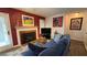 Cozy living room featuring a fireplace, comfortable seating, and unique artwork at 672 Mcgill Ne Pl # 672, Atlanta, GA 30312