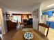 Open concept kitchen and living room area, complete with hardwood floors and fireplace at 672 Mcgill Ne Pl # 672, Atlanta, GA 30312