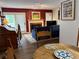Open concept living room with a fireplace, hardwood floors, and access to a patio at 672 Mcgill Ne Pl # 672, Atlanta, GA 30312