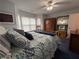 Bright bedroom with a brass bed frame, bay window, ceiling fan and an armoire at 672 Mcgill Ne Pl # 672, Atlanta, GA 30312