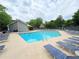 Inviting community pool with plenty of lounge chairs and manicured landscape at 672 Mcgill Ne Pl # 672, Atlanta, GA 30312