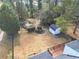 Large backyard featuring an in-ground pool, storage shed, garden and deck at 1831 Dresden Dr, Brookhaven, GA 30319