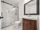 Stylish bathroom featuring glass shower with black trim and classic vanity at 1831 Dresden Dr, Brookhaven, GA 30319