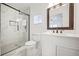 Beautiful bathroom with glass shower, marble tile, and white vanity at 1831 Dresden Dr, Brookhaven, GA 30319