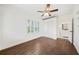 Cozy bedroom with hardwood floors, window shutters, ceiling fan, and ensuite at 1831 Dresden Dr, Brookhaven, GA 30319