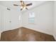 Bright bedroom featuring wood floors, white trim, and a ceiling fan at 1831 Dresden Dr, Brookhaven, GA 30319