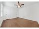 Spacious bedroom featuring hardwood floors, neutral paint, and ceiling fan at 1831 Dresden Dr, Brookhaven, GA 30319