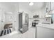 Clean kitchen with stainless steel appliances, white cabinets and marble floors at 1831 Dresden Dr, Brookhaven, GA 30319
