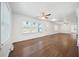 Bright living room with hardwood floors, ceiling fans, and multiple windows at 1831 Dresden Dr, Brookhaven, GA 30319