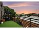 Outdoor balcony featuring black railings, brick exterior, artificial turf, and cityscape views at 204 Walker Sw St # 319, Atlanta, GA 30313