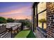 Cozy balcony with black railings, brick exterior, artificial turf, and neighborhood views at 204 Walker Sw St # 319, Atlanta, GA 30313