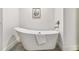 Modern bathroom with freestanding tub, brushed-nickel hardware, and neutral tones at 204 Walker Sw St # 319, Atlanta, GA 30313