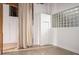 Bedroom with glass block window and storage, offering a modern industrial aesthetic at 204 Walker Sw St # 319, Atlanta, GA 30313