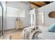 Bright bedroom with modern decor, textured-glass window, and stylish accents at 204 Walker Sw St # 319, Atlanta, GA 30313