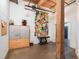 Hallway with mailboxes, artwork, wooden beam, concrete floors and bright lighting at 204 Walker Sw St # 319, Atlanta, GA 30313