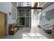 Inviting entryway with seating, plants, and natural light from textured-glass windows at 204 Walker Sw St # 319, Atlanta, GA 30313